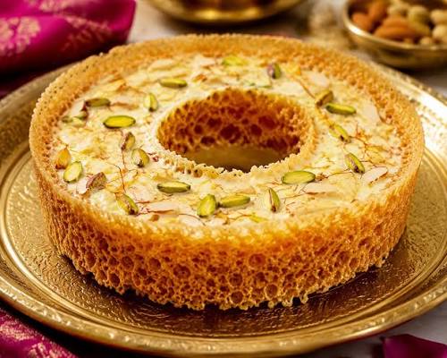 Ghewar Mava topped with mawa, pistachios, almonds and saffron