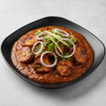 Tawa Gravy Chaap in rich onion tomato gravy with coriander and ginger