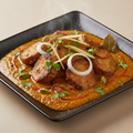 Punjabi Chaap in rich creamy masala gravy with coriander and onion
