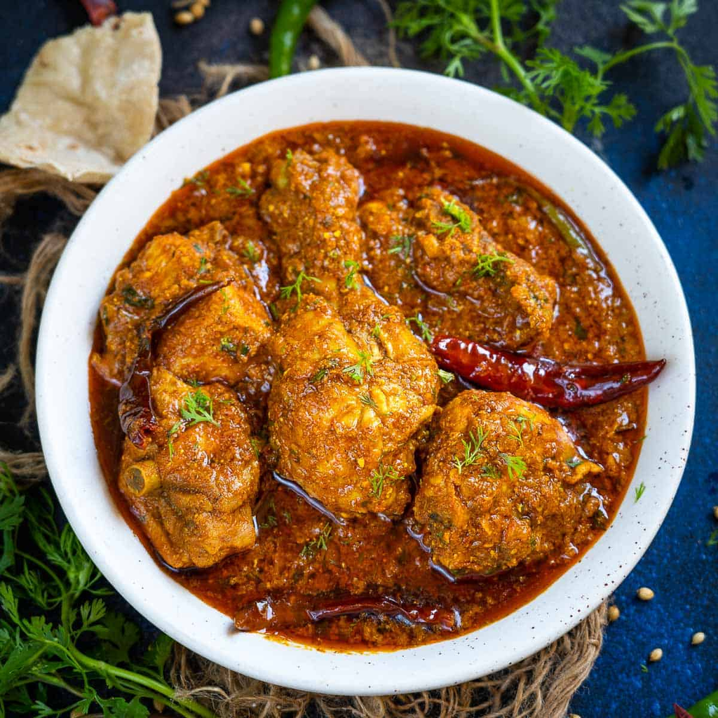 Chicken masala AL Arabian restaurant style curry in white bowl